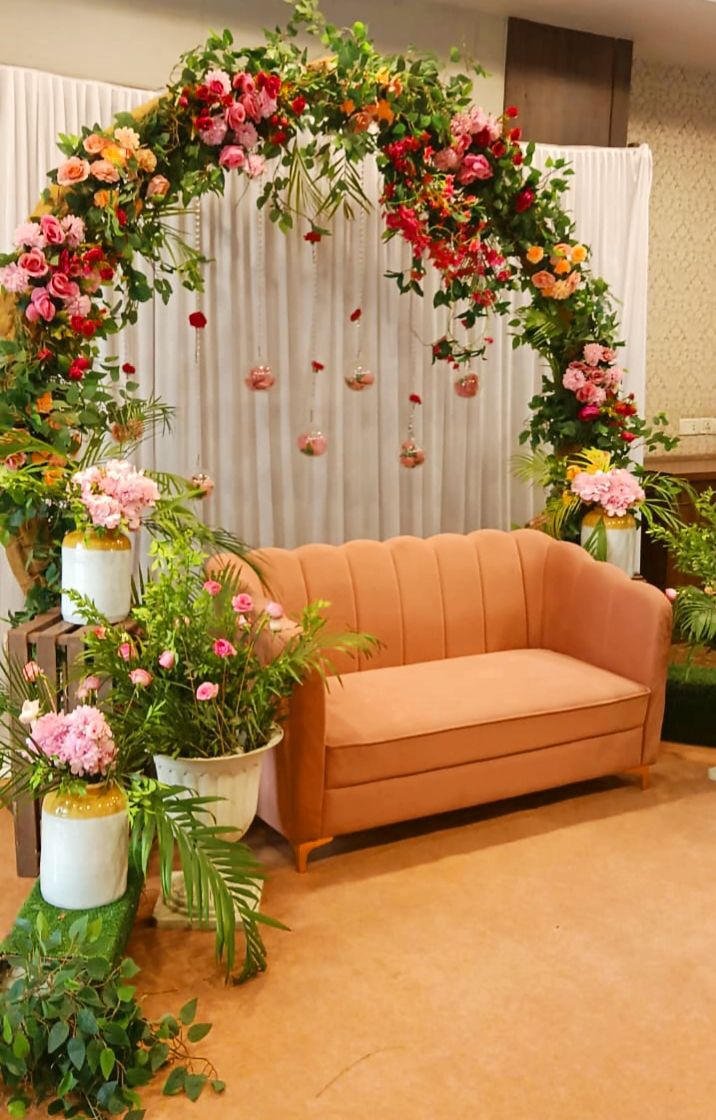 Floral arch seating for wedding reception